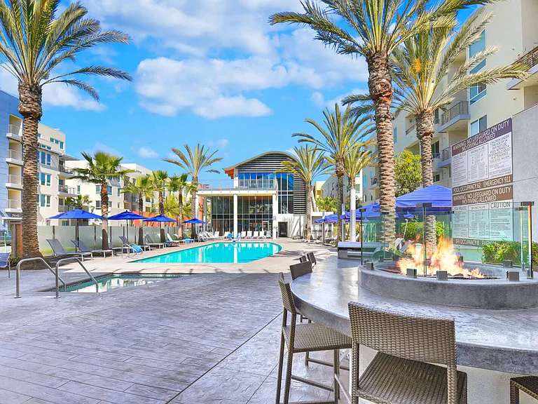 Poolside grilling stations and fire pits make the pool deck a great place to entertain