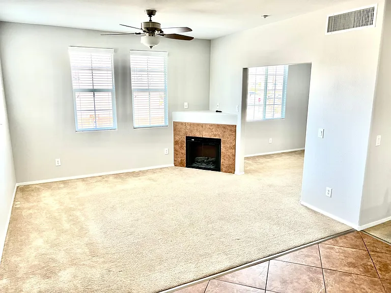 bright living room connects to den