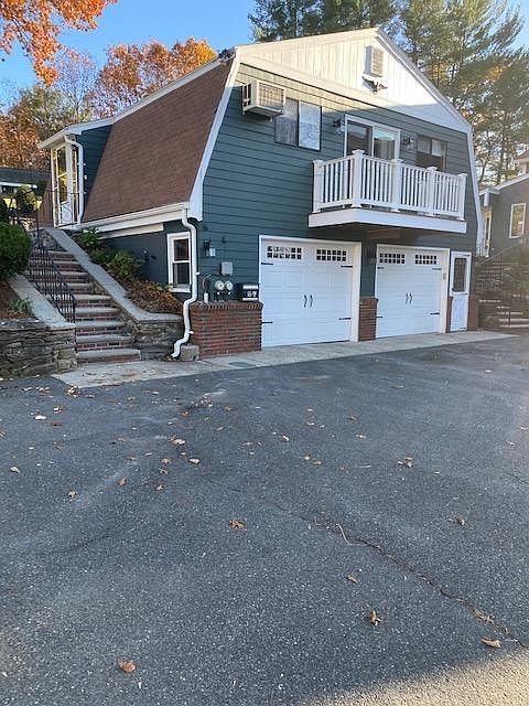 Front Building View with Side/Main Entrance and Front Balcony/Deck