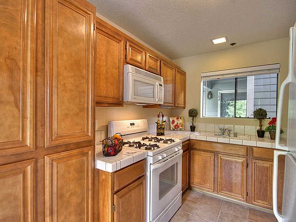 Kitchen includes wood cabinets
