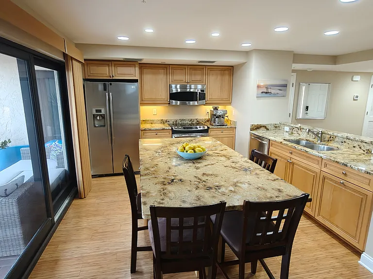 Kitchen w/ island and access to large Gulf facing lanai.