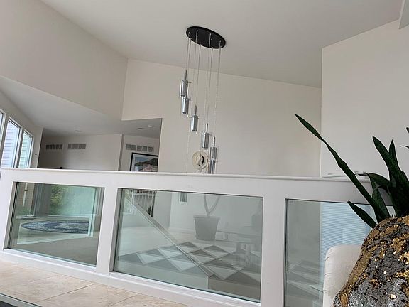 View of front foyer from sunroom