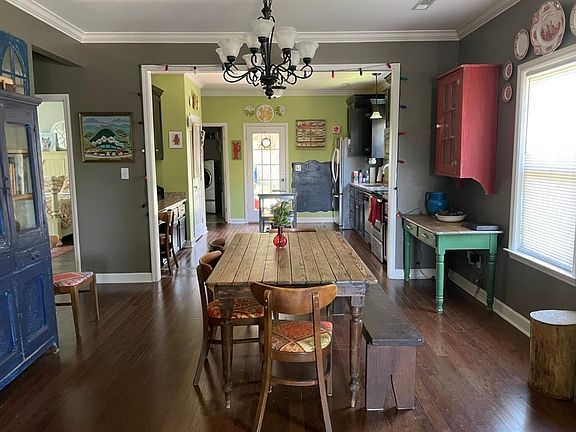 View from front room - dining and kitchen beyond - open and warm floor plan