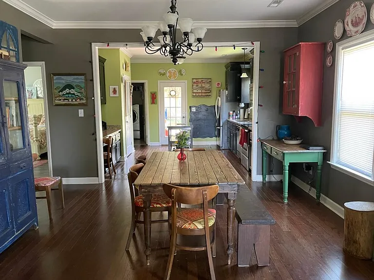 View from front room - dining and kitchen beyond - open and warm floor plan