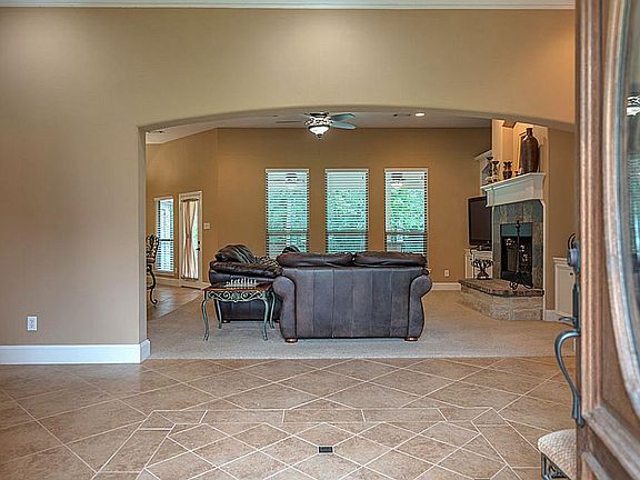 Upon entry you will find a ceramic tile floor and the living room beyond.