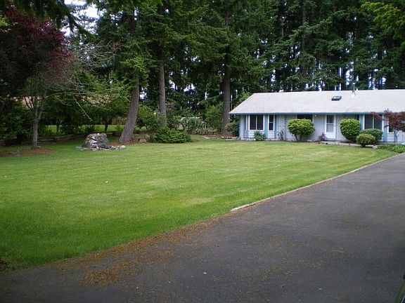 Another view of the front of the home and property. It's nicely set back off the street, lots of pri