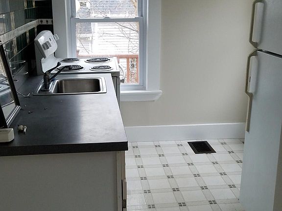 Kitchen with space for small table next to refrigerator