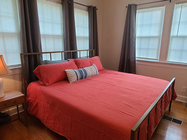 King bedroom with lots of natural light.