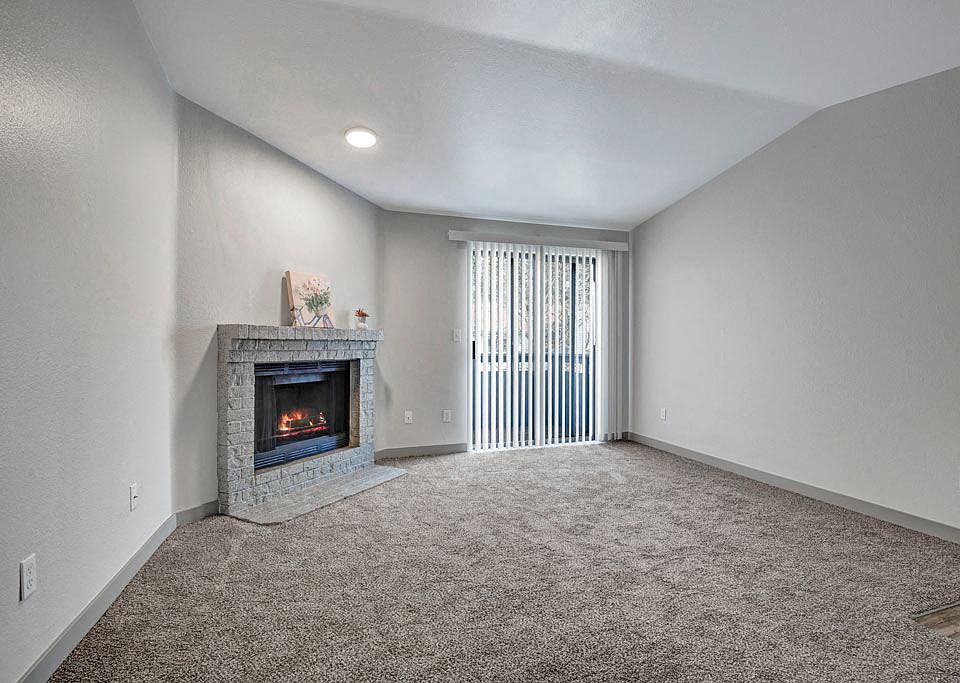 Living Room with Wood-Burning Fireplace - One Bedroom