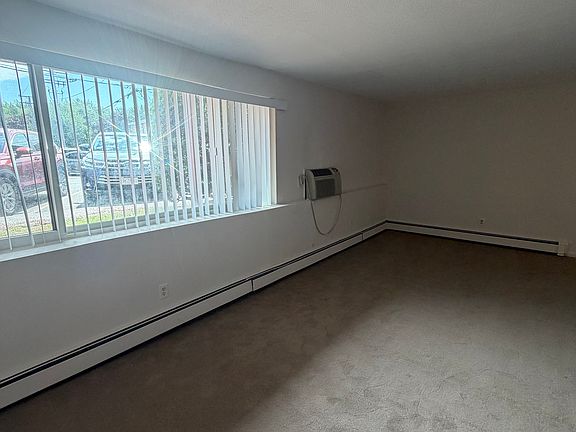 Large livingroom/dining area with lots of natural light