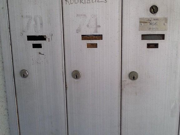 Four mail boxes, one reserved for the landlord.
