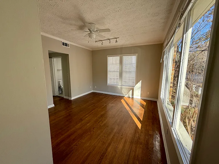 Tall ceilings and hardwood floors throughout the unit.