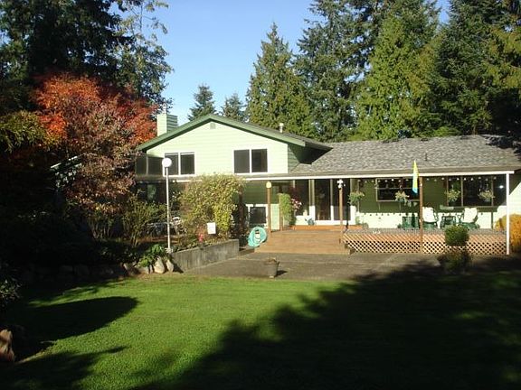 large Level Backyard with covered deck for entertaining year round