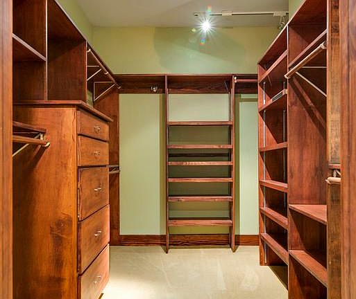 master suite walk in closet with built in dresser