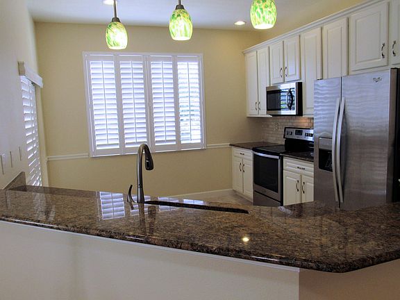 Gourmet kitchen with granite counter tops and stainless steel appliances