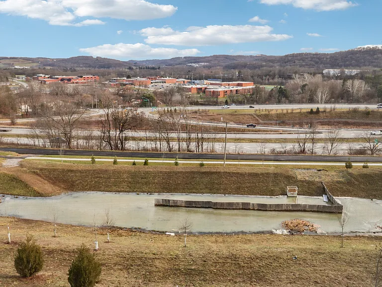 View from walkout basement - pond, community walking trail and Seneca valley school
