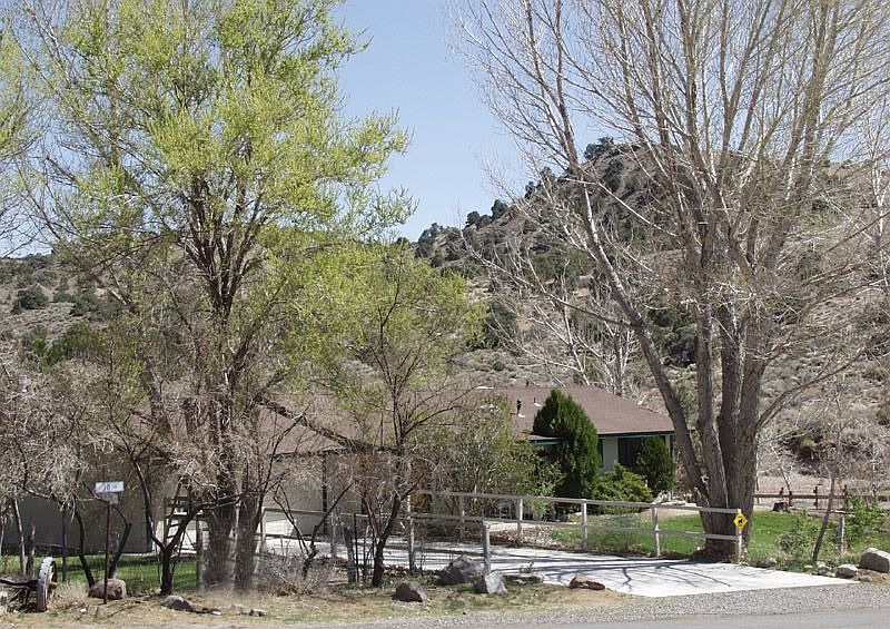 Mature tress surround the home