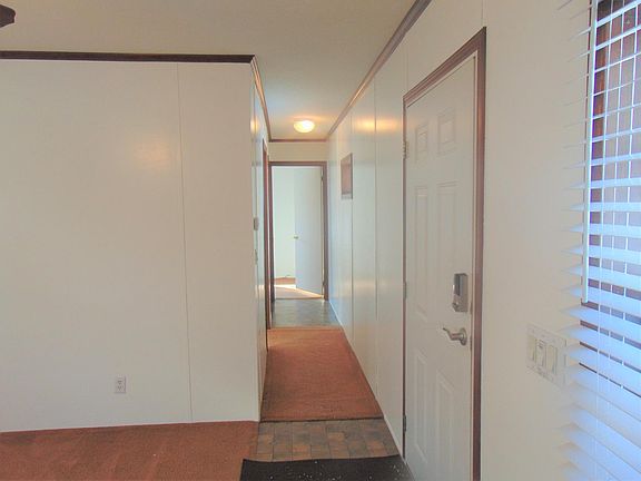 Walking down the hallway to bedrooms. Notice the window to your left in the hallway, to bring in the natural lighting.