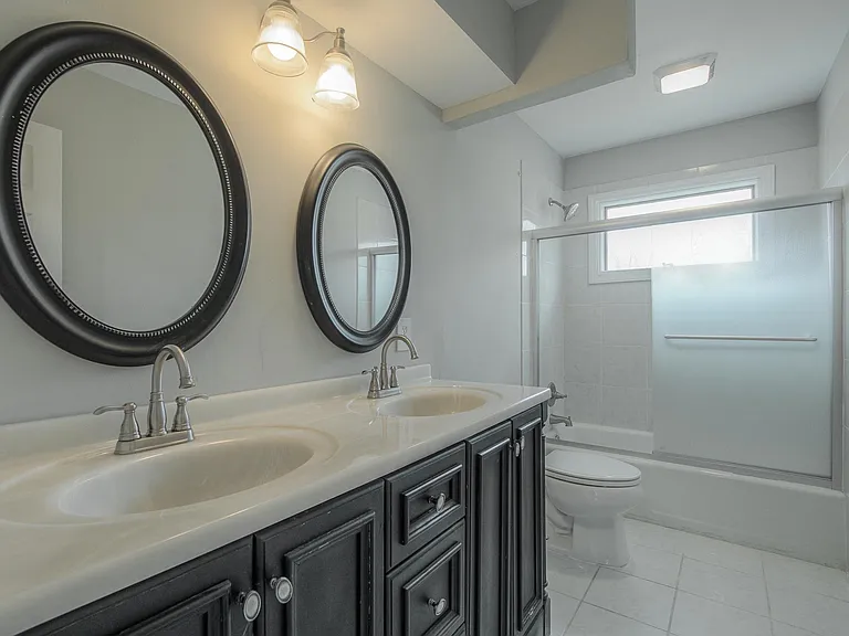 The second bath upstairs is modern and spacious.