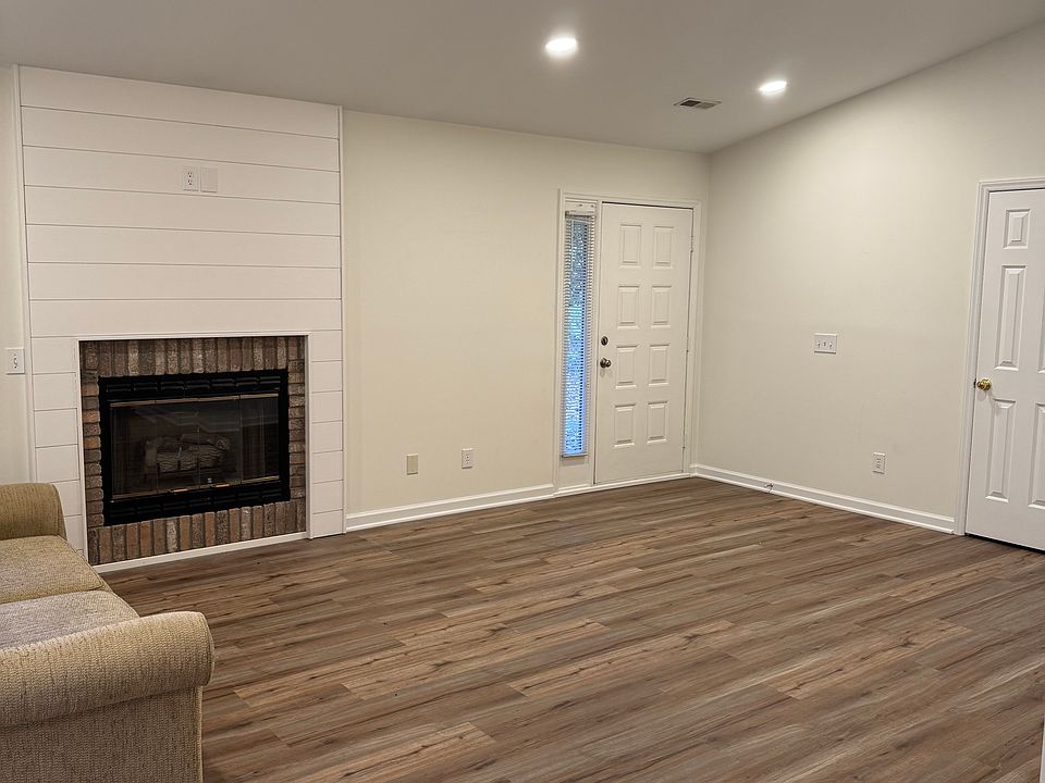Open concept living room with gas logs in the fireplace, and is pre-wired for a television mount over top.
