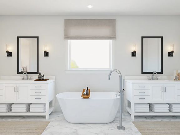 Primary bath with freestanding vanities tub