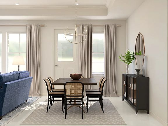 Dining area with chandelier and crown moulding