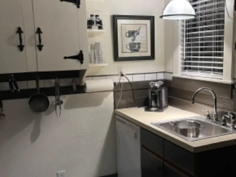 Deco kitchen with a steampunk light fixture created by a well known Atlanta Artist!