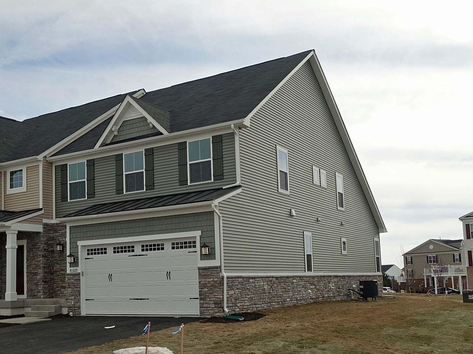 Exterior of Villa has stacked stone on front and side