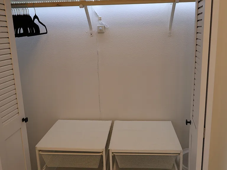 Master bedroom closet with motion-sensor LED lighting.