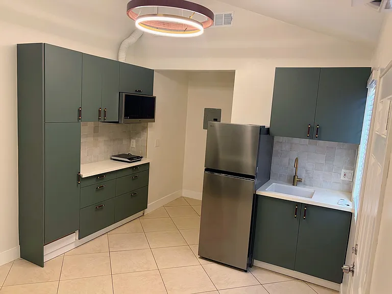 Kitchenette _ Clean kitchenette with refrigerator and convention microwave _ ideal for simple, everyday cooking.