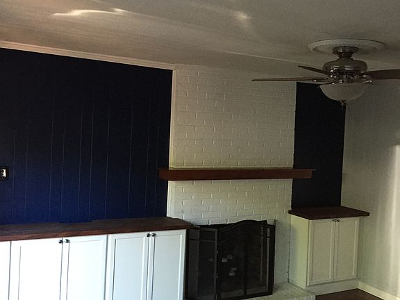 den w/fireplace & builtins