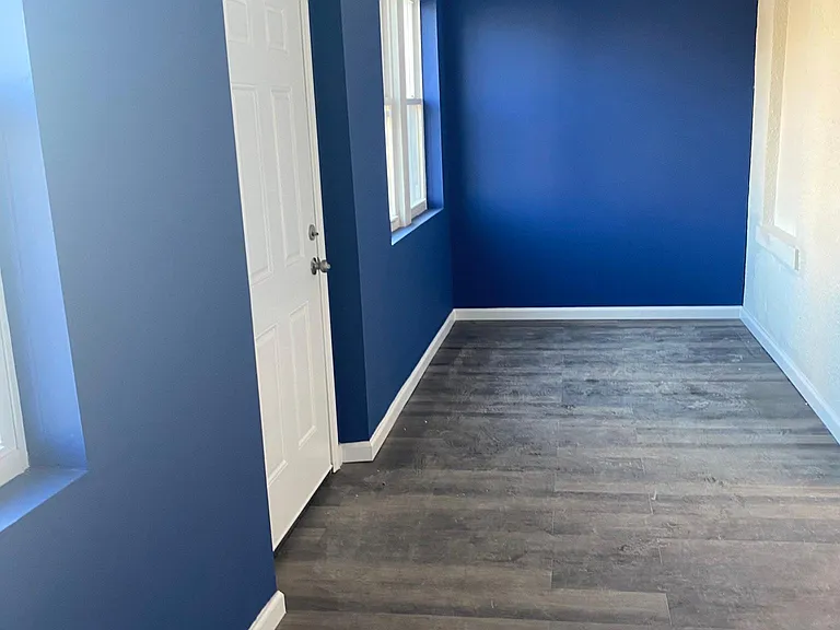 Front porch with front entrance, LED light, laminate floor and 2 full windows.