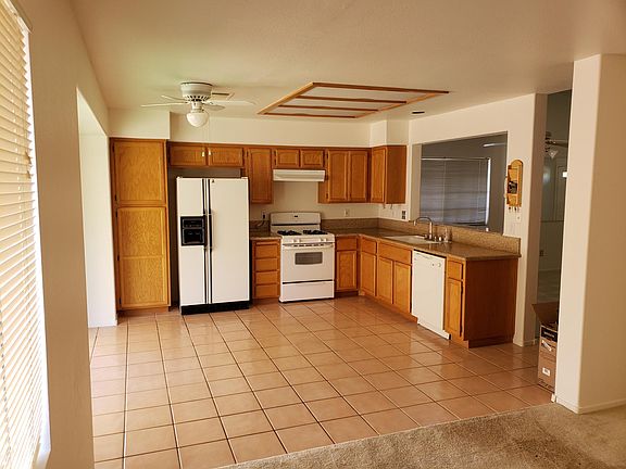 standing in den showing kitchen