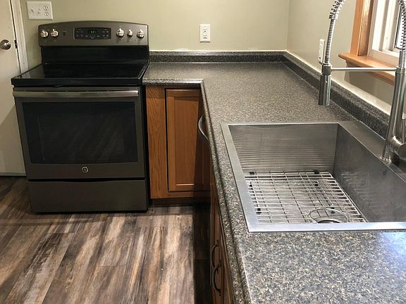 Kitchen facing garage door entrance.