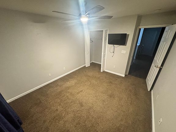 Front bedroom closet (tv included).