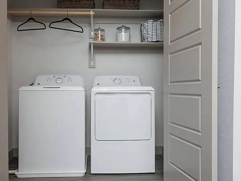 In-Unit Laundry with Full-Size Washer and Dryer and Built-In Shelving