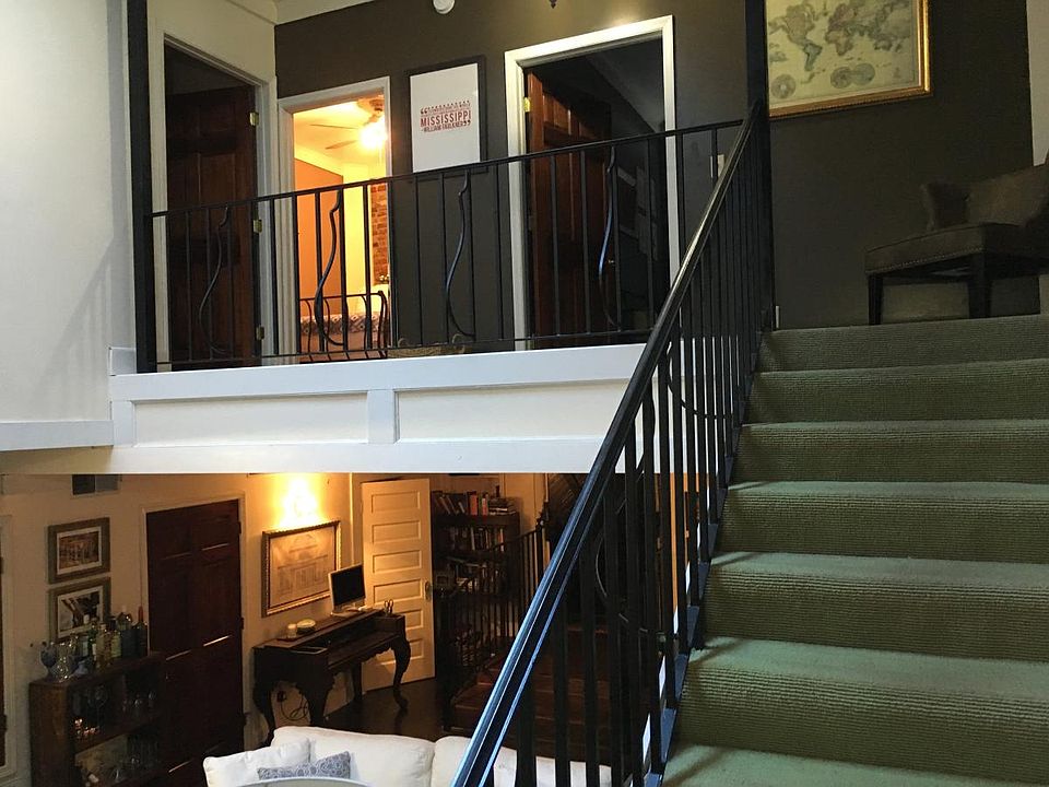 Stairs to the upstairs bedrooms and bathroom