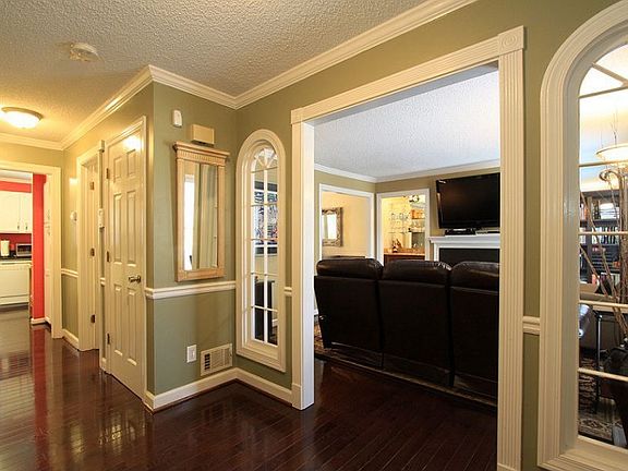 View to living room. Note crown molding and decorative windows & trim.