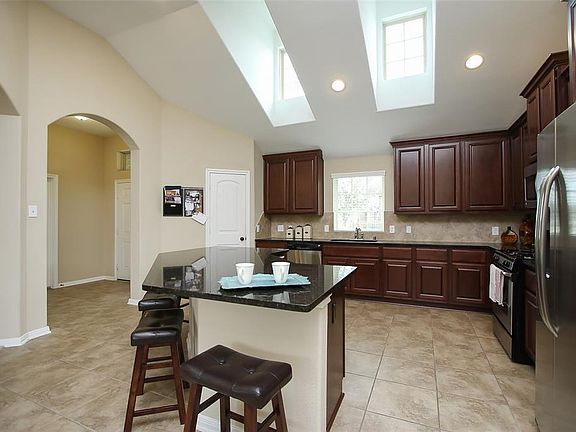Granite counters, open kitchen and sky lights