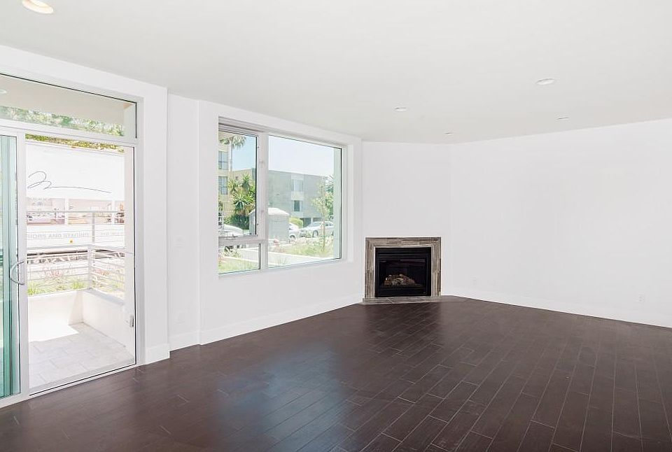 Patio door with living room with gas fireplace