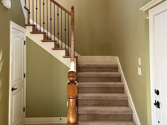Front door with powder bath under the stairs.