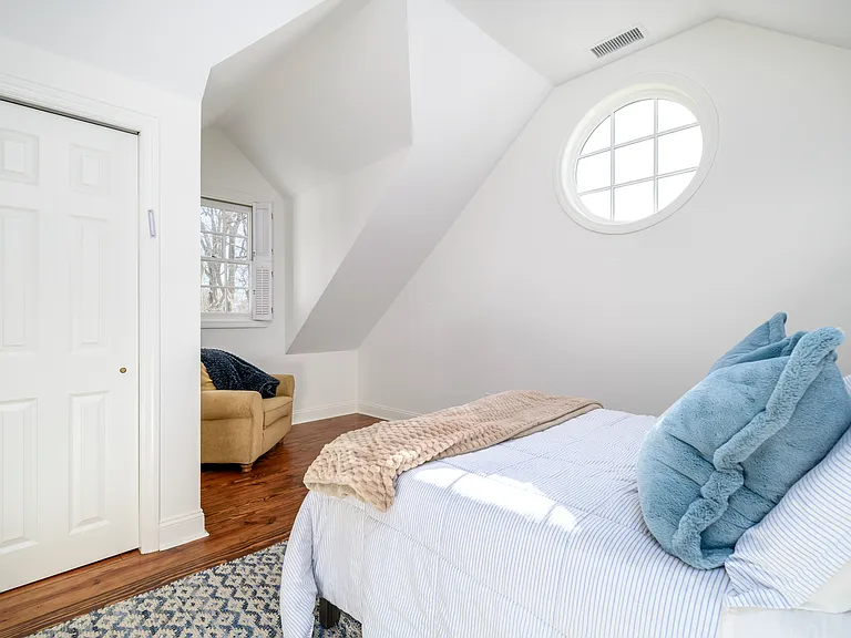 Large room with a reading corner and adjacent bathroom