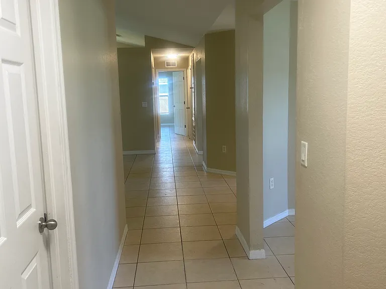 View from guest bathroom to master bedroom side of home