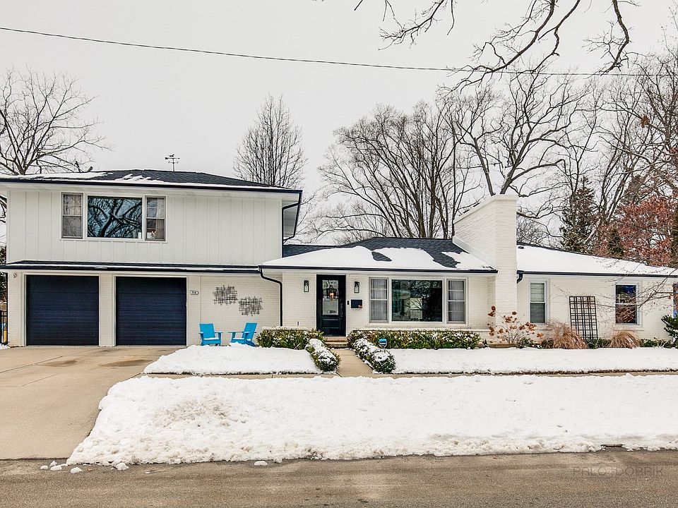 Beautifully updated with NEW Hardie Board siding, gutters, exterior sconces, and even new garage doo