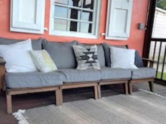 Couch on screened in porch