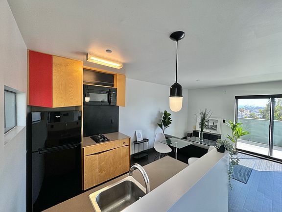 open plan w kitchen island Microwave 2 burner cooktop dishwasher!