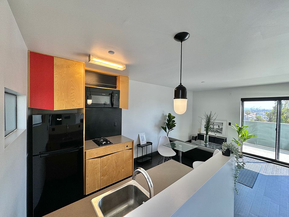 open plan w kitchen island Microwave 2 burner cooktop dishwasher!