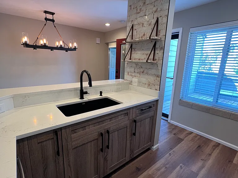 Kitchen with modern fixtures and new sink