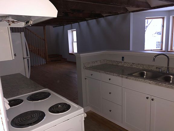 Kitchen looking into living room