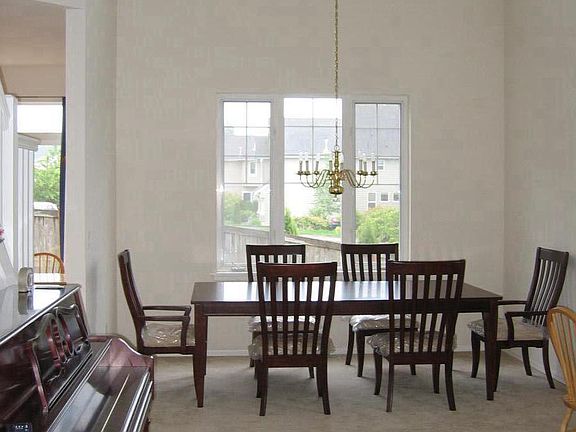 two story high ceiling living room and dining room 
